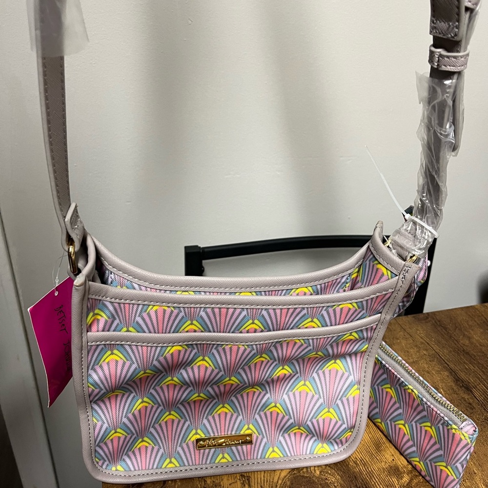 New with tag Betsey Johnson crossbody bag with pouch.